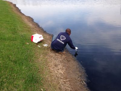 SW-0009
Photo Date: April 21, 2014
Photo Credit: Eric Kaufman
Description: EHS Fikru Hailu collects surface water samples at a pond with 0 % dissolved oxygen due to a release of organic materials from a nearby factory.
