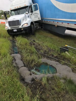 ER-0032
Photo Date: 8/26/2019
Photo Credit: Kyle Fender
Description: A semi jackknifed into a guardrail and drove off the road spilling at least 70+ gallons of diesel fuel into the soil along the interstate
