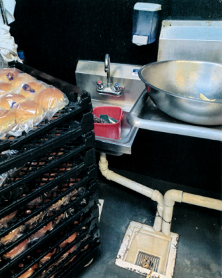 FS-0063
Photo Date: 7-11-2020
Photo Credit: Amy Ayers
Description: Hand sink in facility blocked by bread rack. Hand sink has sanitizer bucket (not in use) stored in hand sink. 
