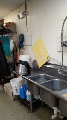 FS-0008
Photo Date: 04/20/2015
Photo Credit: JoAnn Xiong-Mercado
Description: Sticky fly strip hanging above the clean and sanitized drain board of the 3-bay sink.
